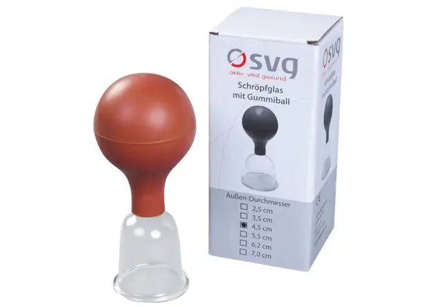 Schröpfglas SVG mit Saugball in 2,5 cm Durchmesser neben Pappkarton