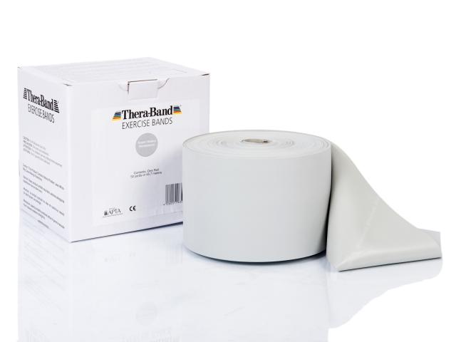 Theraband 45m Rolle Original neben Verpackung in Silber