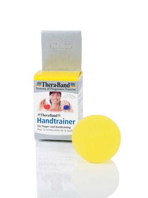 Theraband Ball in gelb neben Verpackung