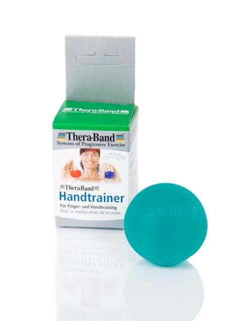 Theraband Ball in grün neben Verpackung