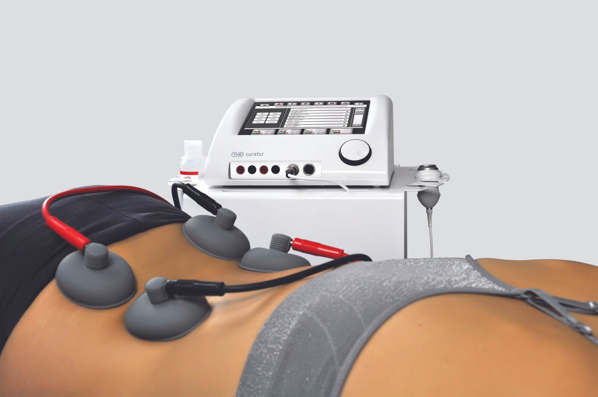 Elektro- und Ultraschallgerät curatur 701 bei Rückenbehandlung bei einer Frau