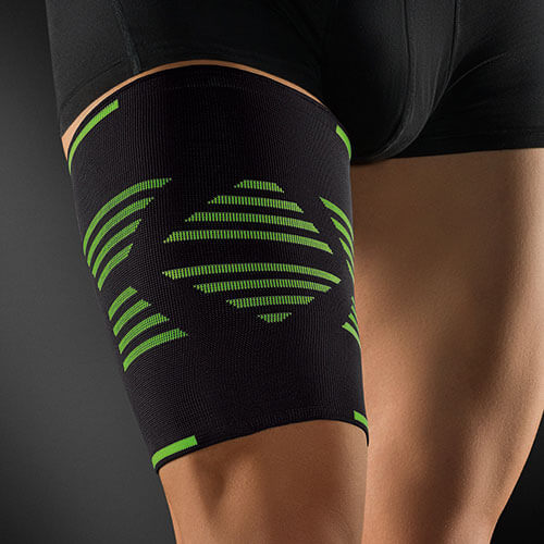 Person trägt Sportbandage für Oberschenkel ActiveColor® Flach-Strickung
